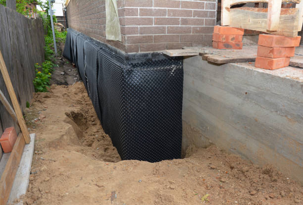 Happy homeowners after waterproofing job in Upperco